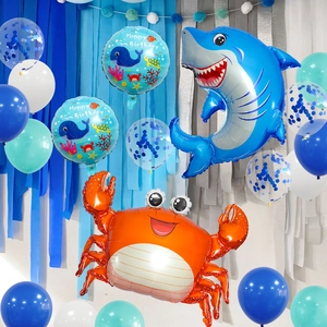 Ocean theme party set with shark and crab foil balloons and blue latex balloons decor