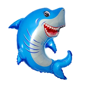 Close-up of a blue cartoon shark foil balloon for ocean themed party decorations