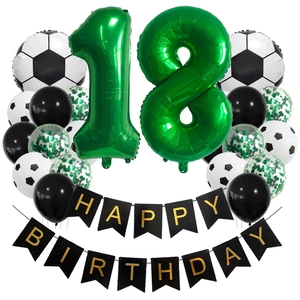 Detail of 18th birthday soccer party set with foil balloons and birthday banner