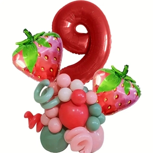 Detail of strawberry themed party balloons with a large red number 9 foil balloon