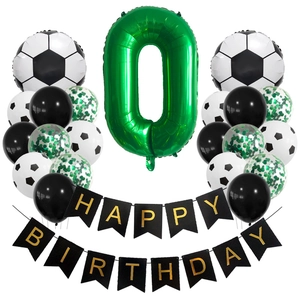 Close-up of football party set with green number 0 foil balloon and soccer latex balloons