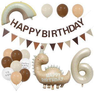 Makro-Detail des Retro-Dinosaurier-Ballons und Geburtstagsbanner-Sets in Karamell