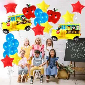 Back to school party setting with school bus and apple balloons around diverse children