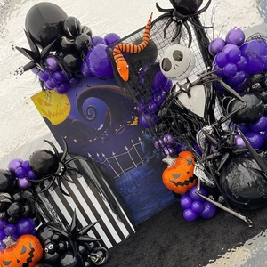 Halloween balloon arch kit with purple balloons and spooky Jack Skellington foil balloon