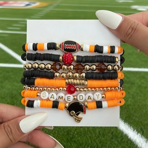 Detail of 7-piece rugby themed bracelet set with Game Day beads and helmet charms