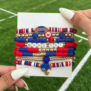 Detail of multi-layer Game Day bracelet set with polymer clay beads and football charms