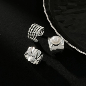 Silver liquid metal pleated wide ring set with faux pearls and twisted geometric bands