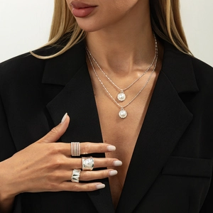 Elegant 925 silver jewelry set with pearl necklace and minimalist tiered rings for women