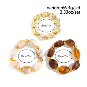 Detailed set of three layered resin beaded bracelets with golden irregular accents and stone texture