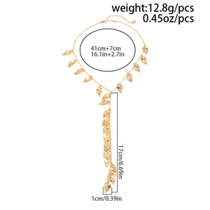 Detail view of gold Y-shaped necklace with hammered leaf charms and size measurements