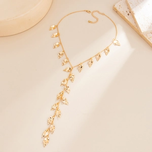 Minimalist Y-shaped gold leaf tassel necklace with multiple textured metal pendants
