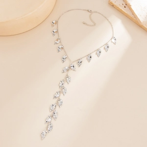 Silver Y-shaped layered necklace with hammered metal leaf pendants in a minimalist style