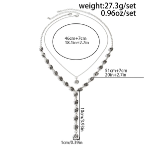 Detailed view of vintage silver Y-shaped necklace with black rose charms and size specs