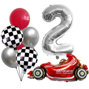 Racing themed party decor with number 2 balloon, red race car and checkered flags