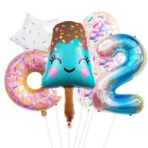 Detail of summer donut and ice cream foil balloons with rainbow number 2 for party decor