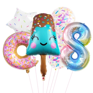 Detail of ice cream and donut foil balloons with number 8 for birthday party decoration
