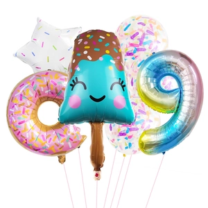 Detail view of summer ice cream and donut theme foil balloons set with gradient number nine