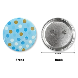 Front and back detail of 58mm Baby Boy tinplate badge with blue polka dots