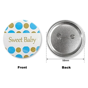 Front and back detail of a 58mm Sweet Baby tinplate badge with blue and gold dots