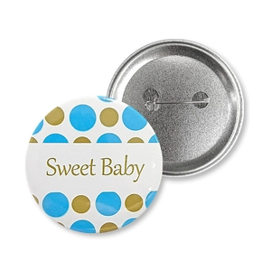 Detail of Sweet Baby tinplate badge with blue dots and pin back for gender reveal party