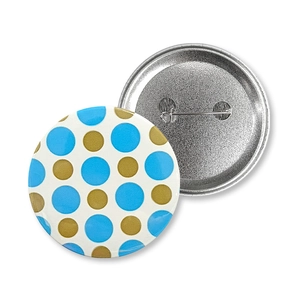 Detailed view of the front and back of a blue polka dot Baby Boy tinplate badge