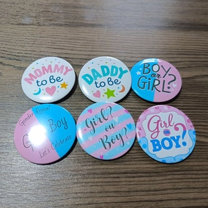 Set of 6 gender reveal party buttons featuring pink and blue boy or girl designs