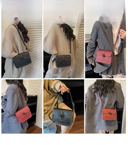 Detail view of stylish crossbody square bags in black and brown with metal ring buckles