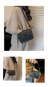 Detail view of black vintage shoulder bag with contrast white stitching and metal lock