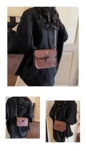 Close-up of brown vintage leather crossbody bag with toggle horn buckle and strap