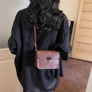 Brown vintage faux leather square bag with toggle closure and white contrast stitching