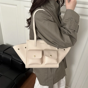 Minimalist beige leather tote bag with wing design and large capacity for women