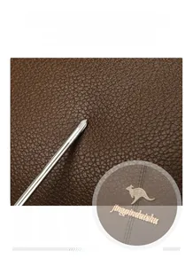 Macro shot showing high elasticity and texture of durable brown lychee grain leather
