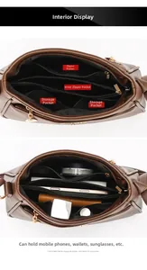 Detail view of large brown leather handbag interior with multiple pockets and compartments