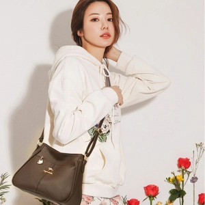 Women's dark brown faux leather shoulder bag with gold kangaroo hardware for daily commute
