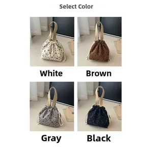 Selection of drawstring tote bags in white, brown, grey and black with butterfly patterns