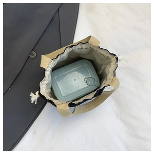 Top view of spacious floral corduroy bag showing lunch box storage and drawstring closure