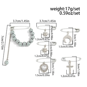 Detail of 6-piece brooch set featuring pearls, snowflake and crescent moon pendants