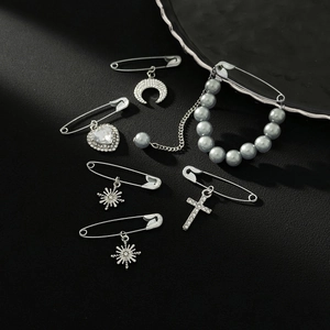 Silver alloy decorative brooch set with crystal moon, heart and cross pendants