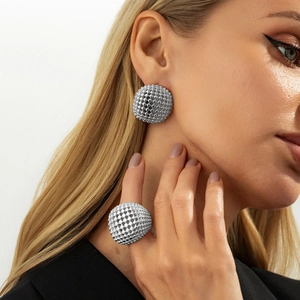 Silver hollow sphere jewelry set featuring textured ball ring and matching stud earrings