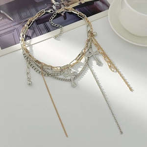 Hip-hop layered cross pendant necklace with gold and silver metallic chains and tassel