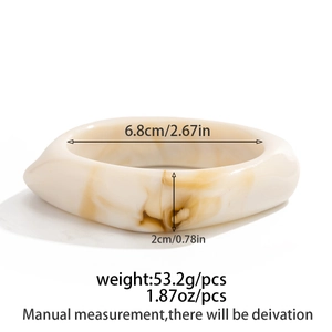 Macro view of irregular resin bangle with dimensions 6.8cm inner diameter and 2cm width