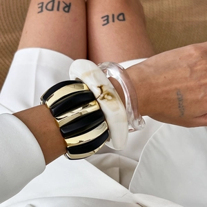 Irregular chunky bracelet set featuring marble resin, black metal and acrylic bangles