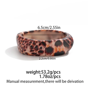 Detail shot of leopard print resin bangle showing dimensions: 6.5cm inner diameter and 2.2cm width