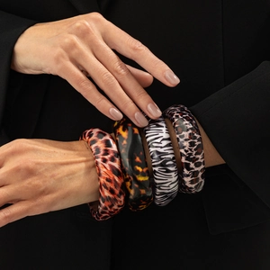 Set of four irregular resin bangles with leopard and animal prints for women
