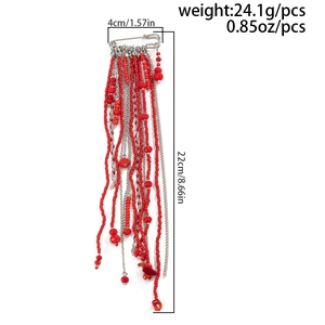 Detail view of red beaded tassel brooch with silver pin, size 4cm x 22cm and 24.1g weight