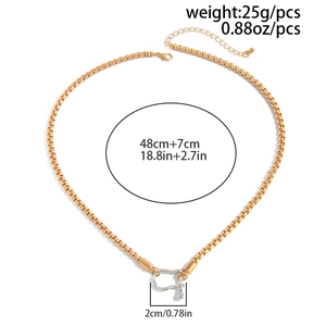 Detail of mixed-metal gold chain necklace with silver horseshoe pendant and sizing info