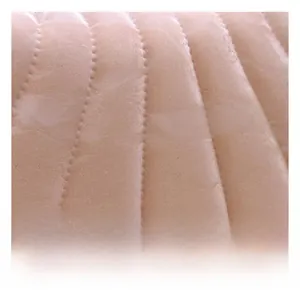 Close-up of pink quilted velvet fabric with vertical wavy stitching and pearl trim