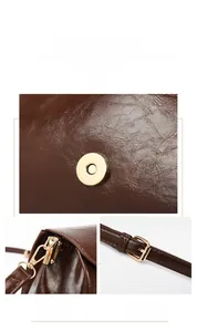 Detail of brown leather bag showing gold magnetic buckle and adjustable metal hardware