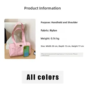 Pink nylon star-patterned pillow bag detail showing 30x13x17cm dimensions and lightweight material