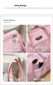 Detail of pink star pattern bag showing smooth metal zipper and handmade metal label